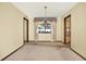 Classic dining room with a chandelier, and a large window offering pleasant views at 10014 118Th Way, Seminole, FL 33772