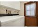 Laundry room with a washer and dryer and a door with a window at 10014 118Th Way, Seminole, FL 33772
