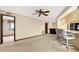 Cozy living room with a built-in bar and a ceiling fan at 10014 118Th Way, Seminole, FL 33772