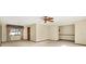 Bright, open living room featuring a ceiling fan and large window at 10014 118Th Way, Seminole, FL 33772