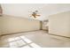 Spacious living room with a ceiling fan and natural light at 10014 118Th Way, Seminole, FL 33772