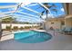 Inviting screened-in pool area with comfortable lounge chairs, perfect for relaxation and outdoor enjoyment at 10014 118Th Way, Seminole, FL 33772