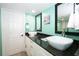 Bathroom with double vessel sinks, granite counters, and modern fixtures at 10034 Burton St, New Port Richey, FL 34654