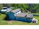 Aerial view of a charming two-story home featuring a spacious backyard, ideal for outdoor activities and relaxation at 10034 Burton St, New Port Richey, FL 34654