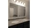 Bathroom features a dual sink vanity with granite counters at 10240 Meadow Wren Ave, Weeki Wachee, FL 34613