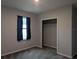 Bedroom featuring neutral walls, closet, and carpeted floors at 10240 Meadow Wren Ave, Weeki Wachee, FL 34613