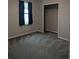 Bedroom featuring neutral walls, closet, and carpeted floors at 10240 Meadow Wren Ave, Weeki Wachee, FL 34613