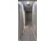 Hallway with tile floors and access to other rooms at 10240 Meadow Wren Ave, Weeki Wachee, FL 34613
