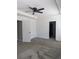 Main bedroom featuring neutral walls, carpet, and access to bath at 10240 Meadow Wren Ave, Weeki Wachee, FL 34613