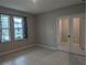 Office space with tile flooring, natural light, and stylish french doors at 10240 Meadow Wren Ave, Weeki Wachee, FL 34613