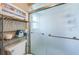 Clean bathroom showcasing a frosted glass enclosed shower and tiled walls at 1031 Ridge View Ln, Palm Harbor, FL 34683