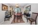 Bright dining area with a table set for six, adjacent to the living area at 1031 Ridge View Ln, Palm Harbor, FL 34683