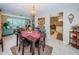 Open dining room and living room area offering tile floors and a view into the kitchen at 1031 Ridge View Ln, Palm Harbor, FL 34683