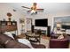 Comfortable living room with hardwood floors, ceiling fan, and ample seating, creating a relaxing and inviting atmosphere at 1031 Ridge View Ln, Palm Harbor, FL 34683