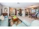 Open-concept living room with a cozy seating area, tile flooring, and lots of sunlight at 1031 Ridge View Ln, Palm Harbor, FL 34683
