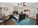 Cozy main bedroom with hardwood floors, a comfortable bed, and ample natural light, creating a serene retreat at 1031 Ridge View Ln, Palm Harbor, FL 34683