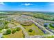 Aerial view of the Sundrift community, showcasing the lake, ponds and single-Gathering homes at 11086 Sundrift Dr, Tampa, FL 33647