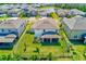 Aerial view of home and backyard with screened in porch and white vinyl fence at 11086 Sundrift Dr, Tampa, FL 33647