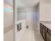 Bright bathroom with granite counters, tiled shower and neutral colors offers a fresh modern feel at 11086 Sundrift Dr, Tampa, FL 33647