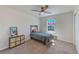 Comfortable bedroom with neutral walls, large window and carpet flooring at 11086 Sundrift Dr, Tampa, FL 33647