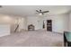 Spacious carpeted bonus room with ceiling fan and multiple doorways at 11086 Sundrift Dr, Tampa, FL 33647