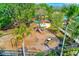 Aerial view of community playground with slides, swings, picnic tables and mature trees at 11086 Sundrift Dr, Tampa, FL 33647