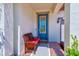 Cozy front porch with seating area and decorative front door creates a warm welcome at 11086 Sundrift Dr, Tampa, FL 33647