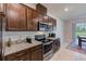 Well-equipped kitchen featuring granite counters, modern appliances, and plenty of storage at 11086 Sundrift Dr, Tampa, FL 33647
