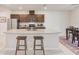 Spacious kitchen featuring a large center island with granite countertops and modern appliances at 11086 Sundrift Dr, Tampa, FL 33647