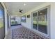 Relaxing screened-in lanai with ceiling fan offers tranquil outdoor living at 11086 Sundrift Dr, Tampa, FL 33647