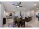 Open-concept living space with dining area, kitchen island, and comfortable living room at 11086 Sundrift Dr, Tampa, FL 33647