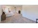 Carpeted main bedroom showcasing a ceiling fan, natural light, and ample space at 11086 Sundrift Dr, Tampa, FL 33647