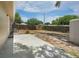 Large backyard featuring a concrete patio, grass and a wood fence for privacy at 12087 105Th Ln, Largo, FL 33773