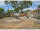 Backyard featuring a shed, wood fence and partial views of a home at 12087 105Th Ln, Largo, FL 33773