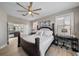 Bedroom with king bed, dual windows for natural light, and en-suite bathroom access at 13325 Sunset Shore Cir, Riverview, FL 33579