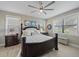 Inviting bedroom featuring a king-size bed, soft lighting, and serene decor at 13325 Sunset Shore Cir, Riverview, FL 33579