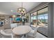 Bright dining area with sliding glass doors leading to the outdoor patio and living space at 13325 Sunset Shore Cir, Riverview, FL 33579