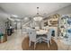 Elegant dining room featuring a round table with seating for four and a stylish chandelier for a sophisticated touch at 13325 Sunset Shore Cir, Riverview, FL 33579