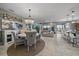 Open-concept dining and living area showcasing ample natural light and a seamless transition between spaces at 13325 Sunset Shore Cir, Riverview, FL 33579
