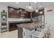 Modern kitchen boasts granite counters, stainless appliances, and a stylish backsplash at 13325 Sunset Shore Cir, Riverview, FL 33579