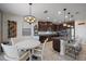 Beautiful kitchen featuring dark wood cabinets, granite countertops, and stainless steel appliances at 13325 Sunset Shore Cir, Riverview, FL 33579