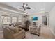 Cozy living room with a couch, chairs, and a TV at 13325 Sunset Shore Cir, Riverview, FL 33579