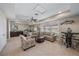 Relaxing living room with neutral walls, cozy furnishings, and a bar area at 13325 Sunset Shore Cir, Riverview, FL 33579