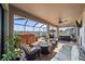 Enjoy this screened patio with a hot tub, gas firepit and comfortable seating at 13325 Sunset Shore Cir, Riverview, FL 33579