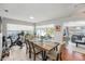 Inviting dining room featuring a wood table, tile floors, bright windows, and neutral tones at 1424 Orange St, Clearwater, FL 33756