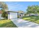 Well-maintained single-story home with two car garage and long concrete driveway at 1424 Orange St, Clearwater, FL 33756