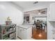 Updated kitchen with a breakfast bar looking into the dining and living room, enhancing flow at 1424 Orange St, Clearwater, FL 33756