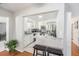 Bright kitchen with white cabinets, stainless steel appliances, breakfast bar, and an open view to other rooms at 1424 Orange St, Clearwater, FL 33756