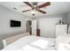 Serene main bedroom with a ceiling fan, closet, and access to the bathroom at 1424 Orange St, Clearwater, FL 33756