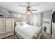 Comfortable bedroom features neutral decor, ceiling fan, and a large window for natural light at 1424 Orange St, Clearwater, FL 33756
